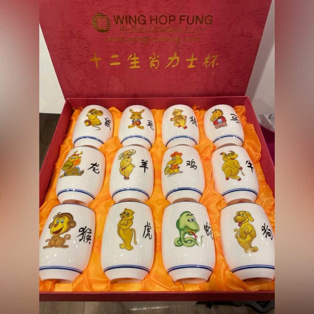 Chinatown cups, painted zodiac details. Nestled in yellow fabric, vintage!